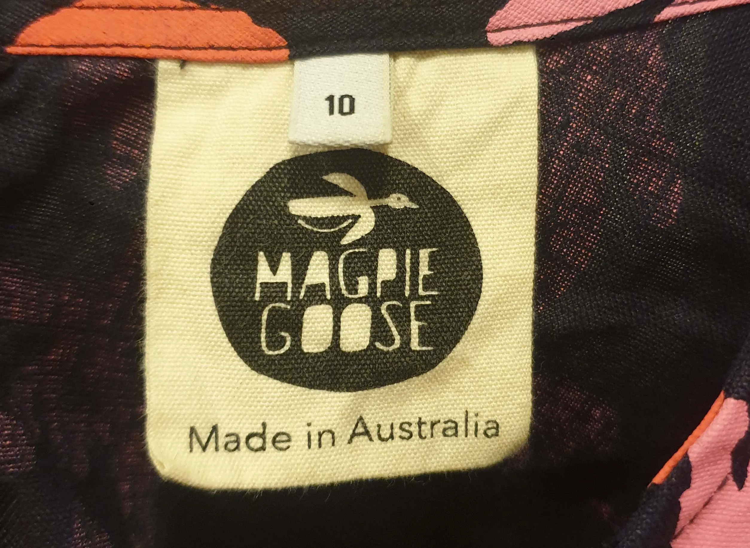 Magpie Goose black linen top with bright pink print size 10